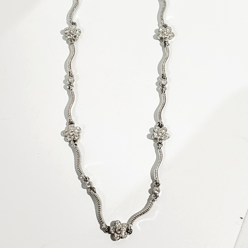 Vtg S.P signed (Avon?) Silvertone floral and wave Rhinestone necklace 18"